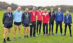  ??  ?? On the run Winners Ben Hukins, Justin Carter and Charlie Thomson (centre) celebrate