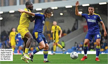  ?? ?? Deji Oshilaja again had a busy match in midfield for Burton.