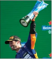  ?? (AP Photo/Luca Bruno) ?? Daniel Ricciardo of Australia celebrates after winning the Italian Grand Prix on Sunday in Monza, Italy. It was Ricciardo’s first win since Monaco in 2018.