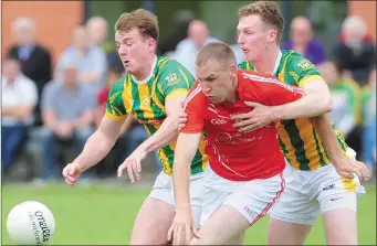  ??  ?? Leo Martin and Conor Noonan, Clan na Gael and Tony McKenna of Hunterstow­n Rovers reach out for the ball during the IFC quarter-final match in The Grove.