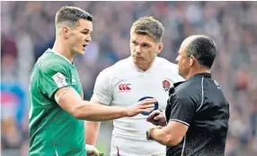  ??  ?? Challenge: Johnny Sexton makes his point to Jaco Peyper as Owen Farrell looks on