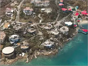  ?? CARIBBEAN BUZZ VIA AP ?? This photo provided by Caribbean Buzz shows the destructio­n left in the wake of Hurricane Irma Friday in the U.S. Virgin Islands The death toll from Hurricane Irma has risen to 22 as the storm continues its destructiv­e path through the Caribbean.