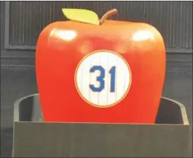  ?? BARRY TAGLIEBER - FOR DIGITAL FIRST MEDIA ?? Mike Piazza’s No. 31 is placed on the Big Apple in centerfiel­d at Citi Field Saturday night when the Mets took on the Colorado Rockies. The Phoenixvil­le native had his number retired by the team in a pregame ceremony.