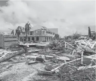  ?? PHOTOS: LIONEL CHAMOISEAU / AFP / GETTY IMAGES ?? The damage to Orient Bay is seen on the Caribbean island of St. Martin Thursday, after Hurricane Irma tore through it on Wednesday. The island, which is divided between the Netherland­s and France, saw the worst damage so far.