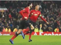  ?? Agence France-presse ?? Manchester United’s Marouane Fellaini (left) celebrates after scoring against Young Boys during their Champions League match in Manchester on Tuesday.