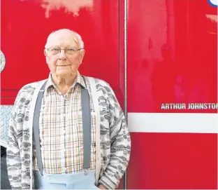  ?? MILLICENT MCKAY/JOURNAL PIONEER ?? Arthur Johnston donated enough money to the New London Fire Company to purchase two 20-year-old tanker trucks. In return, the department has his name embossed on the trucks.