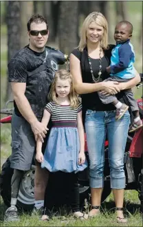  ??  ?? Mike Rousselle, with his wife Brett and children Montana, 7, and Jonas, 3. They’re planning to add a third child to their family.