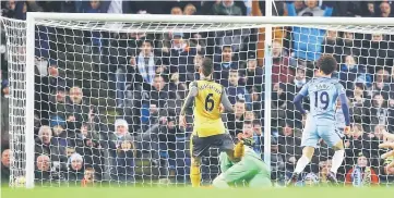  ??  ?? Manchester City’s Leroy Sane scores their first goal. — Reuters photo