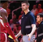  ?? (University of Arkansas Athletics) ?? Pat Ackerman, the recruiting coordinato­r for Arkansas’ men’s basketball program, has also gained a reputation as a fine barber with members of the Razorbacks’ staff, including Coach Eric Musselman.