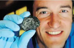  ??  ?? EDMONTON JOURNAL, POSTMEDIA NEWS U of A’s Chris Herd is part of an internatio­nal team analyzing Martian meteorites containing the building blocks of life.