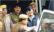  ??  ?? BSP MP Dhananjay Singh, surrounded by police officials, leaving the Patiala House court in New Delhi. HT FILE