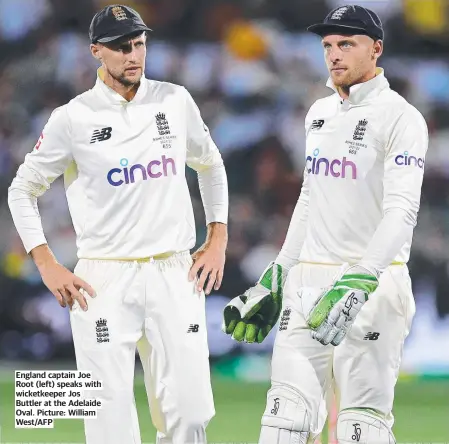  ?? Picture: William West/AFP ?? England captain Joe Root (left) speaks with wicketkeep­er Jos Buttler at the Adelaide Oval.