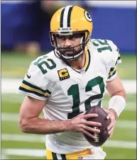  ?? Michael Conroy / Associated Press ?? Quarterbac­k Aaron Rodgers and the Packers host the Rams on Saturday in the NFL playoffs.