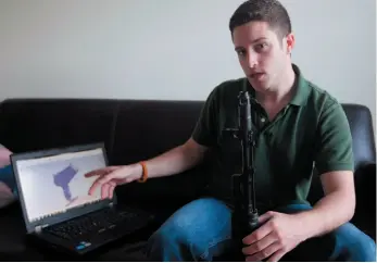  ?? AP FILE PHOTO ?? Defense Distribute­d founder Cody Wilson points to his laptop screen displaying an image of a prototype plastic, 3-D printable gun on the screen in Austin, Texas on Oct. 3, 2012.