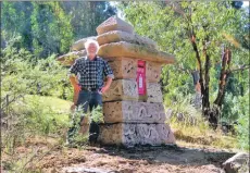  ??  ?? Graham Kinnear stands next to his Machrie postbox on his private 100-acre property.