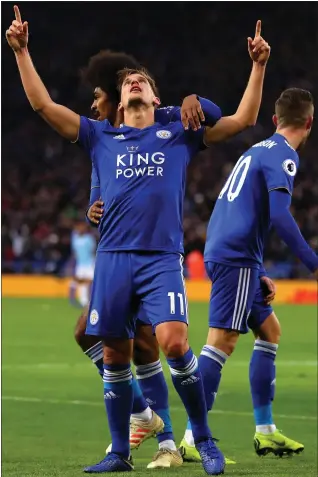  ??  ?? Marc Albrighton celebrates after drawing first blood for Leicester against Manchester City yesterday