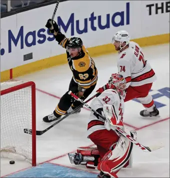  ?? STUART CAHILL / HERALD STAFF FILE ?? UNDER THE KNIFE: Brad Marchand, seen scoring against Carolina’s Antti Raanta in Game 6 of the Bruins’ Eastern Conference playoff series with the Hurricanes, may need surgery on his injured hip.