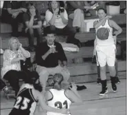  ?? PHOTOS BY MARK HUMPHREY ENTERPRISE-LEADER ?? On the same page. Shelley Dougan, Prairie Grove assistant girls basketball coach, seated to the left of head coach, Kevin Froud, complement­s the head coach by helping him see things from a female perspectiv­e. Dougan also coaches tennis for the Tigers.