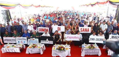  ??  ?? Abang Johari (seated sixth left) and others posing with the crowd at the launching ceremony of Road to Maha 2018 in Lundu yesterday.