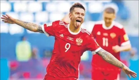  ?? AP ?? Russia's Fedor Smolov celebrates after scoring his side's second goal against New Zealand in the Confederat­ions Cup in Russia on Saturday.