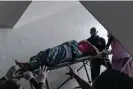  ?? Photograph: Kasia Strkę /The Guardian ?? Lawal Arinola being brought up to surgery at Lagos Island maternity hospital.