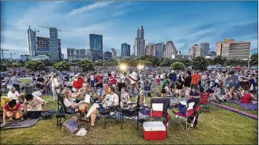  ?? JOHN GUTIERREZ FOR AMERICAN-STATESMAN ?? The Fourth of July concert and fireworks will happen again along Lady Bird Lake downtown.