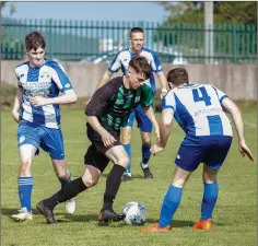  ??  ?? Arklow United’s Shane Connolly looks for a gap.