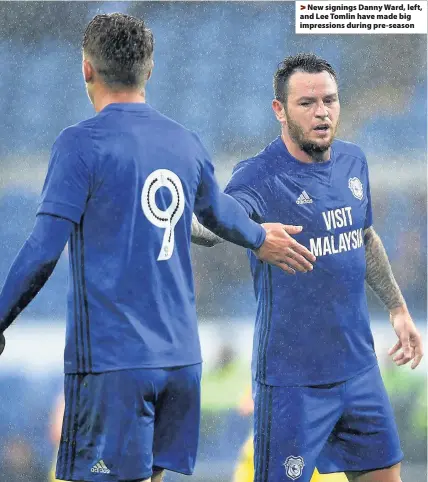  ??  ?? > New signings Danny Ward, left, and Lee Tomlin have made big impression­s during pre-season