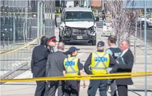  ?? AARON VINCENT ELKAIM THE CANADIAN PRESS FILE PHOTO ?? Police gather at the scene of the Yonge Street van attack in April 2018. Alek Minassian has pleaded not guilty to 10 counts of first-degree murder and 16 counts of attempted murder.