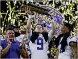  ?? ASSOCIATED PRESS ?? Bengals rookie quarterbac­k Joe Burrow holds the trophy after LSU defeated Clemson for the national championsh­ip in New Orleans last season.