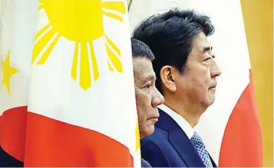  ??  ?? JAPAN VISIT – President Duterte and Japanese Prime Minister Shinzo Abe review a guard of honor at Abe’s official residence in Tokyo, Japan, Monday. Duterte is on a three-day working visit to Japan. (Reuters)