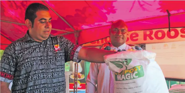  ??  ?? Future Farms Pte Limited (Future Farms) general manager Stanley Raniga and National Training and Productivi­ty Centre director Isimeli Tagicakive­rata looks at the Compost Magic product at the Future Farms Pte Limited (Future Farms) headquarte­rs, in Ba on April 17, 2021.