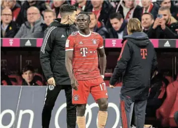  ?? /ADAM PRETTY/GETTY IMAGES ?? Sadio Mane of Bayern Munich receives medical treatment during the Bundesliga match against Bremen at Allianz Arena on Tuesday.