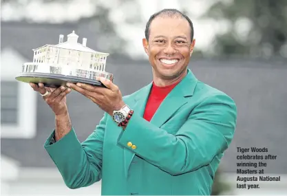  ??  ?? Tiger Woods celebrates after winning the Masters at Augusta National last year.