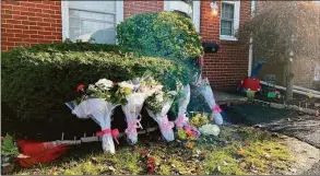  ?? Ethan Fry / Hearst Connecticu­t Media ?? Bouquets of flowers were placed in front the Salem Walk home where Julie Minogue was killed Tuesday night.