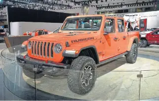  ??  ?? The new Jeep Gladiator will be aimed at the leisure market if it arrives in SA in 2019. Far left: Taylor Langhals, lead exterior designer for the new Jeep Gladiator, designed it with dirt bike transport in mind. Below: Who needs doors anyway?