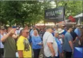  ??  ?? A large crowd of people formed outside the track’s Union Avenue entrance on Monday, waiting for a Saratoga Race Course blanket giveaway.