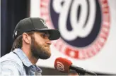  ?? Toni L. Sandys / Washington Post via Getty Images ?? All-Star outfielder Bryce Harper signed a 13-year deal with the Phillies, ending months of speculatio­n about his future.