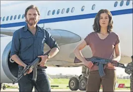  ?? [FOCUS FEATURES] ?? Wilfried Bose (Daniel Bruhl) and Brigitte Kuhlmann (Rosamund Pike) in “7 Days in Entebbe” "7 Days in Entebbe." MPAA rating: Running time: Now showing