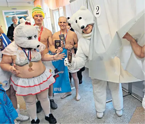  ??  ?? Clockwise from above: the ‘Polar Bear’ swimmers vote in the city of Barnaul; a lavatory ‘booth’ protest over a voting ban on Russian citizens living in Ukraine; a new mother votes at a hospital; a man votes at his house in Buyanovo, north of Smolensk