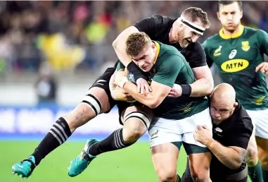  ??  ?? South Africa’s Malcolm Marx is tackled by New Zealand’s captain Kieran Read during the Rugby Championsh­ip match at Westpac Stadium in Wellington in this Sept 15 file photo. — Reuters photo