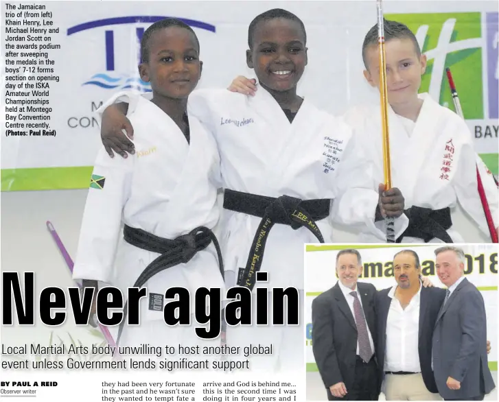  ?? (Photos: Paul Reid) ?? The Jamaican trio of (from left) Khain Henry, Lee Michael Henry and Jordan Scott on the awards podium after sweeping the medals in the boys’ 7-12 forms section on opening day of the ISKA Amateur World Championsh­ips held at Montego Bay Convention Centre recently.