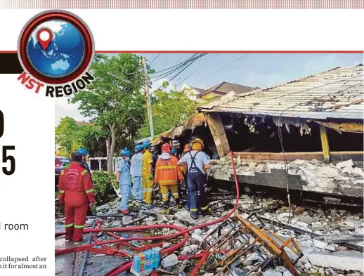  ?? AFP PIC ?? Rescue workers inspecting what’s left of a three-storey building in Thon Buri, Bangkok that collapsed on Saturday.