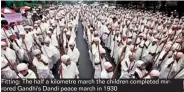  ??  ?? Fitting: The half a kilometre march the children completed mirrored Gandhi's Dandi peace march in 1930