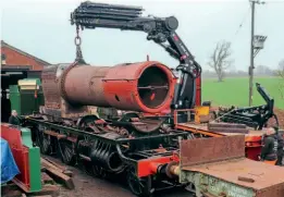  ?? LEE THORP/ESR ?? The boiler for GWR 2-6-2T No. 4110 was trial fitted into the frames at Cranmore on January 25.