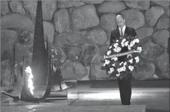  ?? AP POOL PHOTO ?? Britain’s Prince William lays a wreath during a memorial ceremony at the Yad Vashem Holocaust Memorial in Jerusalem on Tuesday.