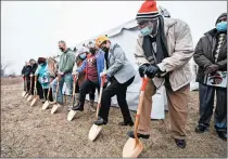  ?? KYLE TELECHAN/POST-TRIBUNE ?? Veterans and officials break ground on a transition­al home for female veterans Monday in Merrillvil­le.