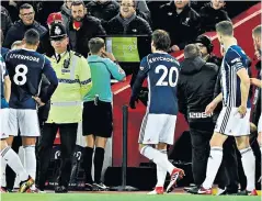  ??  ?? Screen test: Referee Craig Pawson uses the VAR system in an FA Cup game