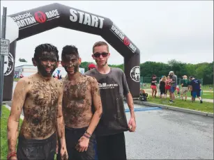  ??  ?? Below: From left, Jack Martins, Jaydon Jarvis, and Alex Cyr of North Smithfield show off the end result of a day spent at the Reviver Challenge.