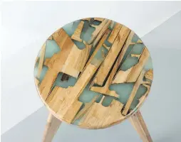  ??  ?? Wood-and-resin Zero Per Stool consists of white oak and left-over wood pieces set in resin.